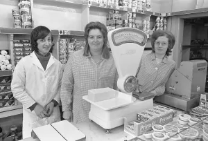 Staff behind the counter of the Maypole Grocery store in Warwick Staff behind the counter of the Maypole Grocery store in Warwick