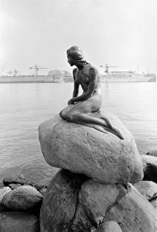 Images Dated 7th May 1975: The statue of the Little Mermaid guards the entrance to the port of Copenhagen May