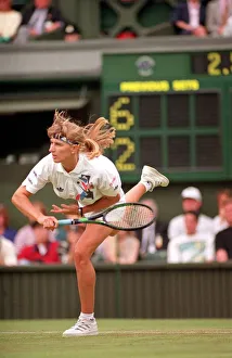 STEFFI GRAF IN ACTION PLAYING ON COURT AT THE 1993 WIMBLEDON TENNIS TOURNAMENT STEFFI GRAF IN ACTION PLAYING ON COURT AT THE 1993 WIMBLEDON TENNIS TOURNAMENT