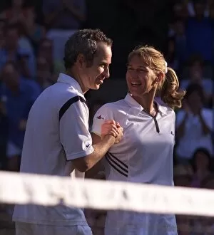 Images Dated 2nd July 1999: Steffi Graf and John McEnroe celebrate victory July 1999in the Mixed Doubles at Wimbledon
