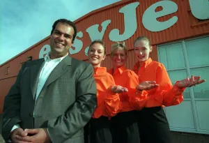 Stelios Haji-Loannou easyJet boss October 1997 with three stewardesses outside hangar at Stelios Haji-Loannou easyJet boss October 1997 with three stewardesses outside hangar at