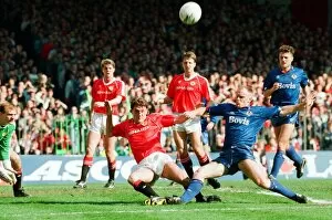 Images Dated 8th April 1990: Steve Bruce tries to keep out Andy Ritchie. FA Cup. Manchester United 3 v Oldham Athletic
