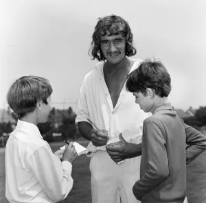 Steve Kember of Crystal Palace signs autographs before taking part in cricket match Steve Kember of Crystal Palace signs autographs before taking part in cricket match