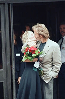 Images Dated 20th August 1992: Sting holds and his bride Trudie Styler outside Camden register office, London