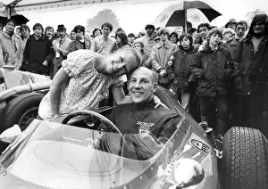 Stirling Moss sitting in Ferrari racing car with wife Suzy standing beside hie at Oulton Stirling Moss sitting in Ferrari racing car with wife Suzy standing beside hie at Oulton