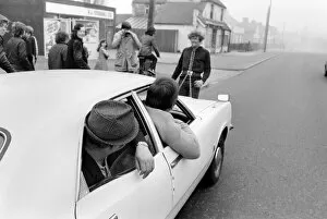 Strongman Reg Morris pulls car and passengers with his teeth. February 1975 75-00777-005