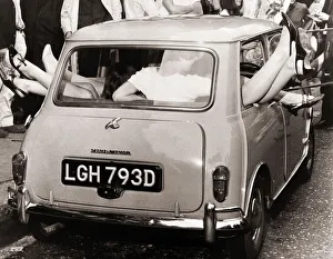 00047 Gallery: Stunts 13 mini-skirted girls managed to cram into a Mini car