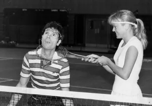 Sue Barker fooling around with Cliff Richard at doubles tennis match - December 1986 Sue Barker fooling around with Cliff Richard at doubles tennis match - December 1986