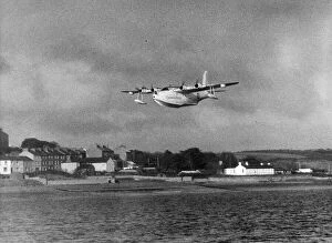 Flight Collection: A Sunderland Flying Boat spreads its wings over the Pembrokeshire village of Neyland as