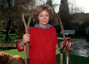 Images Dated 21st February 1990: Susannah York actress in garden Feb 90 holding garden tools A©Mirrorpix