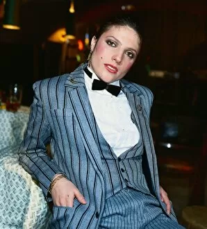 Suzanne Danielle actress March 1982 wearing grey black striped suit white shirt