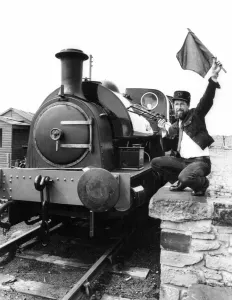 Tanfield Railway Association guard Bob Payne flags away the newly-commissioned Hawthorn Tanfield Railway Association guard Bob Payne flags away the newly-commissioned Hawthorn