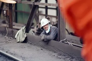 Last tap of Cleveland Iron blast furnace, a furnace man waits for the final tapping to Last tap of Cleveland Iron blast furnace, a furnace man waits for the final tapping to
