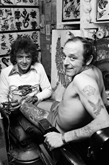Images Dated 1st September 1979: Tattooist Jimmy Gould has bought the skin of his client, Brian Cowell. September 1979