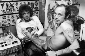 Images Dated 1st September 1979: Tattooist Jimmy Gould has bought the skin of his client, Brian Cowell. September 1979