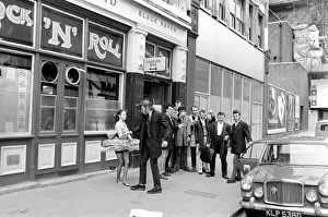 Former Teddy boys gathered outside the Rock n Roll cafe. May 1975 Former Teddy boys gathered outside the Rock n Roll cafe. May 1975