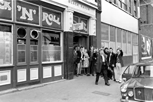 Former Teddy boys gathered outside the Rock n Roll cafe. May 1975 Former Teddy boys gathered outside the Rock n Roll cafe. May 1975