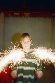 Images Dated 28th October 1994: Teenage boy with Fireworks, 28th October 1994