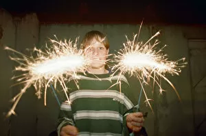 Images Dated 28th October 1994: Teenage boy with Fireworks, 28th October 1994