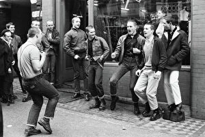 Images Dated 24th October 2012: Teenage Skinheads dancing the Moonstomp outside a shop in London. 29th March 1980