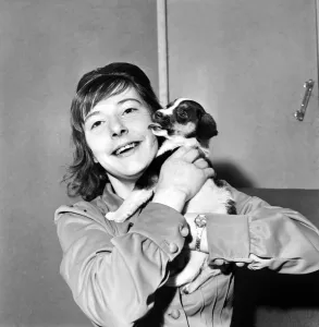 Images Dated 4th December 1970: Teenager Cathy Rowntree aged 19 and puppy 'Patches'