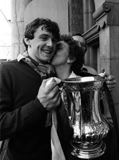 Images Dated 12th May 1980: Teenager Paul Allen holds the FA Cup as his mother gives him a kiss on the cheek at