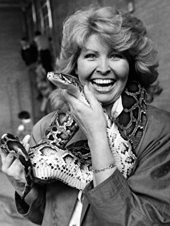 Images Dated 15th May 1988: Television presenter Cathy Secker with Sid the snake at St Bedes School Fete