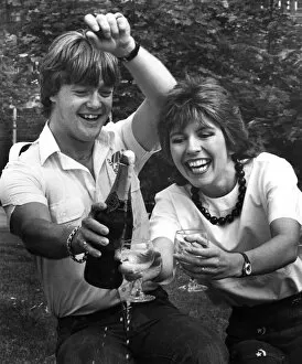 Television presenter Maggie Philbin and husband Keith Chegwin celebrating with a bottle