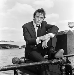 Core26 Gallery: Terence Stamp actor sitting on railing beside the River Thames. 13th September 1962