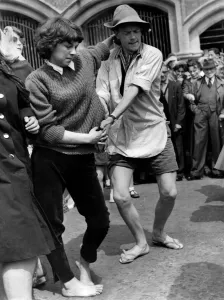 Terry Gray, aged 20 of Crookham, Hants, in shirt and sandals dances with Ann Buckridge of Terry Gray, aged 20 of Crookham, Hants, in shirt and sandals dances with Ann Buckridge of