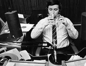 Images Dated 22nd January 1970: Terry Wogan drinking a jug of water during his record programme on Radio One