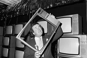 Terry Wogan was given 100 new TV sets today. They are being presented by Phillips the TV Terry Wogan was given 100 new TV sets today. They are being presented by Phillips the TV