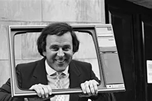 Images Dated 6th September 1984: Terry Wogan was given 100 new TV sets today. They are being presented by Phillips the TV