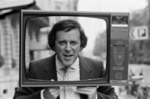 Images Dated 6th September 1984: Terry Wogan was given 100 new TV sets today. They are being presented by Phillips the TV