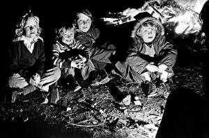 Images Dated 5th November 1974: The thrills of Guy Fawkes night are reflected in the faces of these youngsters as they