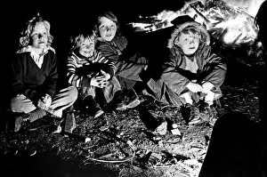 The thrills of Guy Fawkes night are reflected in the faces of these youngsters as they The thrills of Guy Fawkes night are reflected in the faces of these youngsters as they