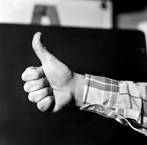 Thumbs up. Mans hand. January 1975 75-00146-002