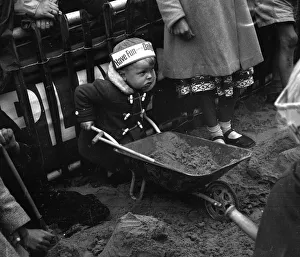 Toddler building a sandcastle at Blackpool beach August 1958 Toddler building a sandcastle at Blackpool beach August 1958