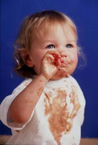 A toddler is pictured eating in April 1999 A toddler is pictured eating in April 1999