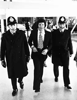 Tom Jones Pop Singer being escorted by Police at Heathrow Airport Tom Jones Pop Singer being escorted by Police at Heathrow Airport