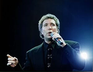 Images Dated 12th May 1991: Tom Jones singing at Wembley Holding Microphone