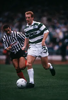 Jon Scan Gallery: Tommy Burns runs past George O Boyle November 1989