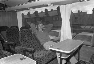 Images Dated 9th February 1973: Tommy Hutchison relaxes on the teams coach before they make the trip to Newcastle