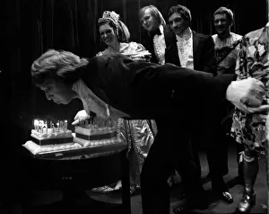 Images Dated 17th December 1975: Tommy Steele 1975 blowing out candles on cake