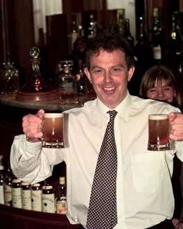 Images Dated 17th April 1997: Tony Blair Labour Party leader in a pub holding two half pints of beer