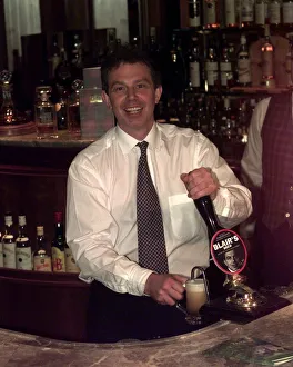 Tony Blair Labour Party leader in a pub pouring a half pint of beer that has been named Tony Blair Labour Party leader in a pub pouring a half pint of beer that has been named