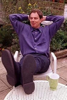 Images Dated 26th March 1997: Tony Blair Labour Party leader relaxing at home sitting in garden with feet up