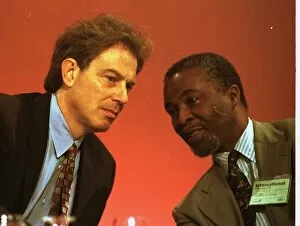Images Dated 5th October 1995: Tony Blair leans over on the platform to talk with Thabo Mebeki of South Africa at