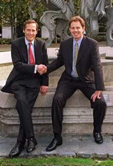 Images Dated 11th October 1995: Tony Blair shakes hands with new MP Tony Howarth sitting at a fountain with sculpture in