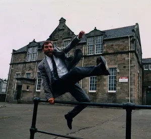 Images Dated 18th September 1991: Bill Torrance - Singer TV Presenter jumping over fence at Broxburn Primary